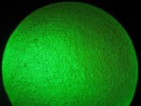 Pointing a green laser pointer at a bouncy ball
