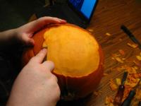 Jane carving our Sans pumpkin