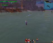 A guy riding his motorcycle across the water at the Darkmoon Faire